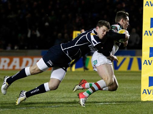 Tom Williams powers in for a Harlequins try