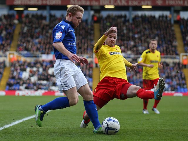 Chris Burke is put under pressure.