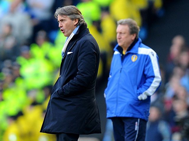 Roberto Mancini and Neil Warnock watch Sunday's FA Cup clash.