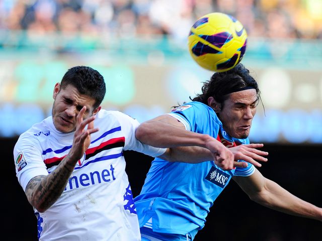 Edinson Cavani wins a header for Napoli