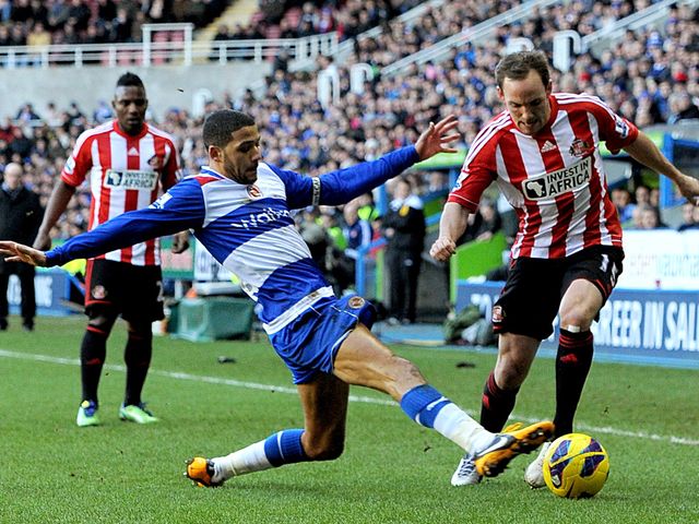 Jobi McAnuff tackles David Vaughan.