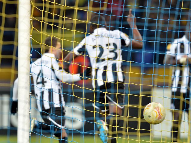 Newcastle celebrate after Ameobi scored the only goal