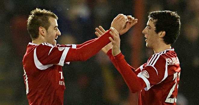 Niall McGinn: Celebrates his fine winner for Aberdeen