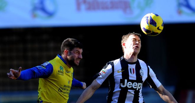 Stephan Lichsteiner battles with Bojan Jokic