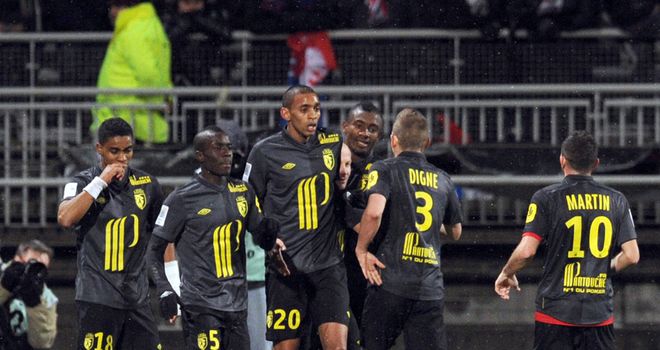 Lille celebrate Florent Balmont's goal.