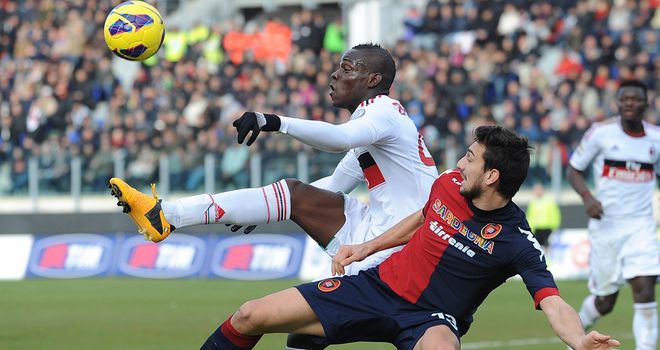 Mario Balotelli tries to get the ball down