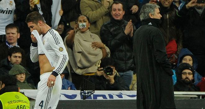 Sergio Ramos passes coach Jose Mourinho after being sent off