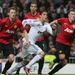 Cristiano Ronaldo tries to dart in between Jonny Evans and Phil Jones