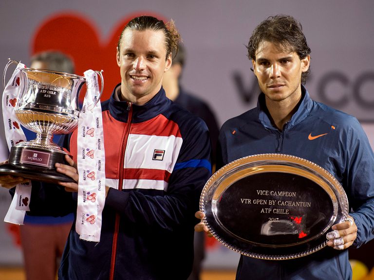 Zeballos poses with the winner's trophy