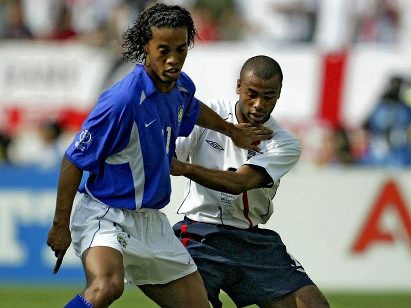 Ashley Cole and England struggle to keep Ronaldinho quiet in a defeat to Brazil in the 2002 World Cup quarter-finals.