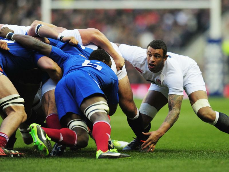 Courtney Lawes just about stays attached to the England scrum