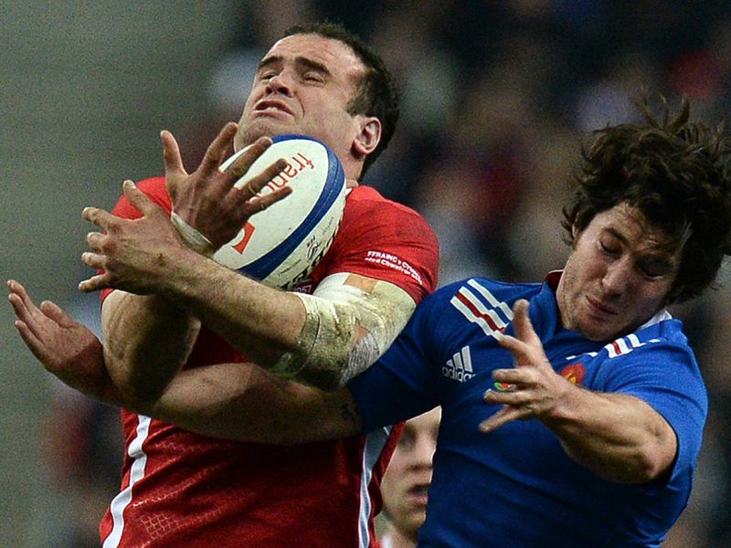 Big catch: Jamie Roberts takes a high ball in front of Maxime Machenaud