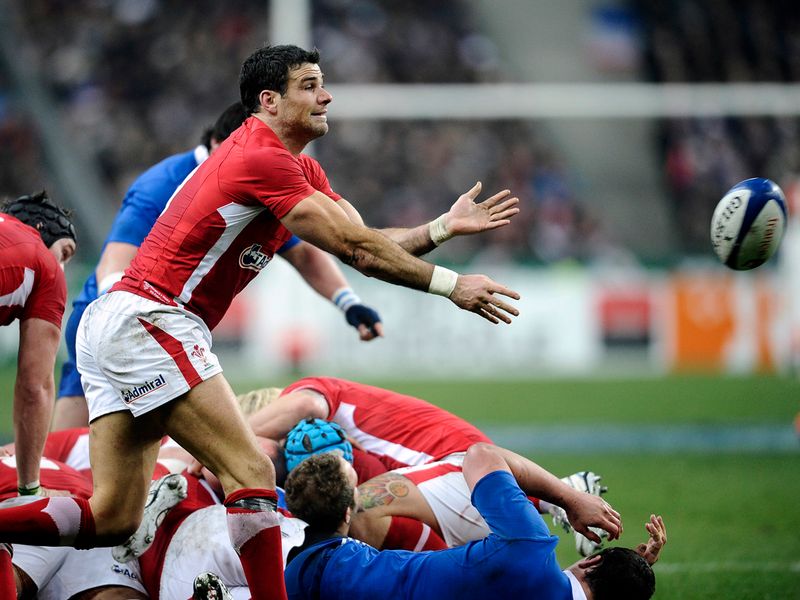 Keeping moving: Mike Phillips passes the ball out from a scrum