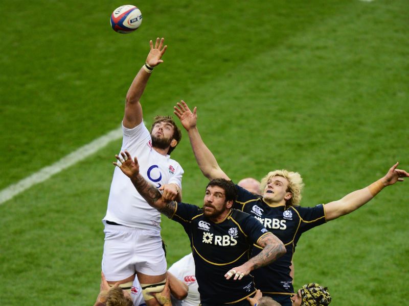 Full stretch: Geoff Parling wins the lineout ball from Scotland's James Hamilton and Richie Gray