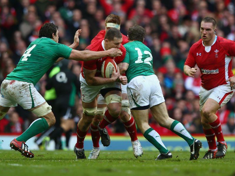 Fully committed: Ian Evans of Wales is tackled by Ireland's Mike McCarthy and Gordon D'Arcy