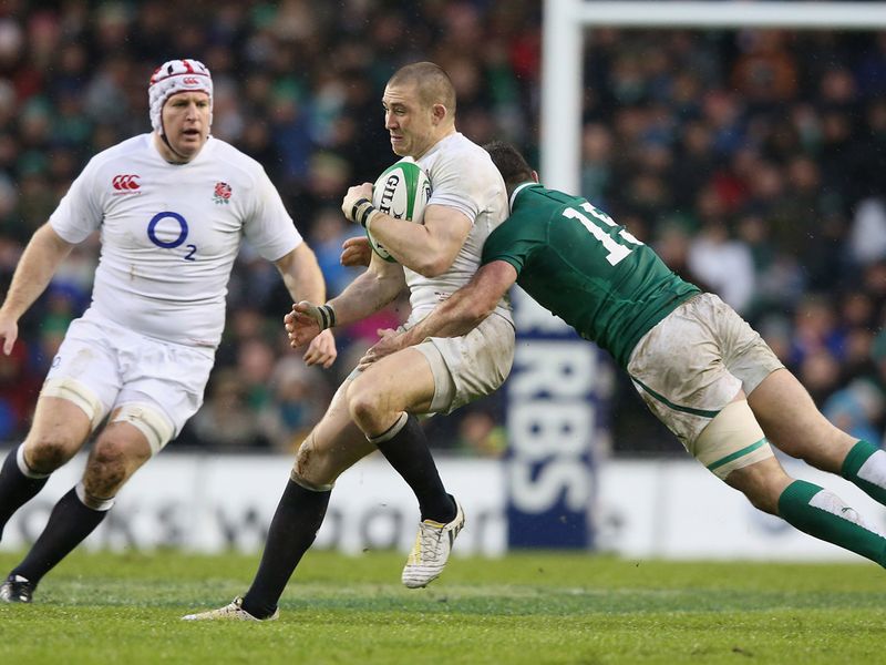 Stopped in his tracks: Mike Brown of England is tackled by Rob Kearney