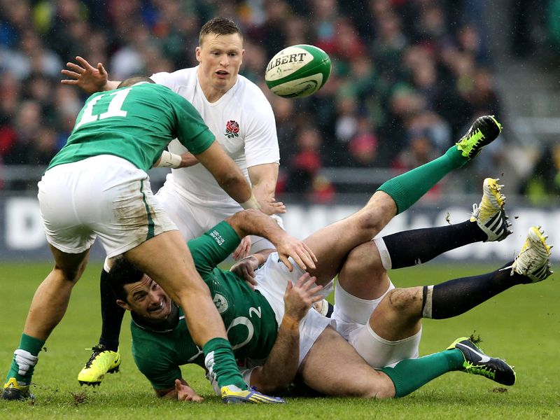 Loose ball: Rob Kearney of Ireland tries to offload possession as he's brought crashing down