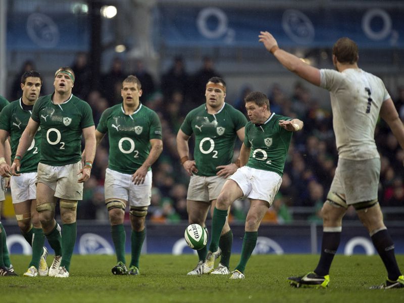 Tactical ploy: Ireland's Ronan O'Gara kicks for touch