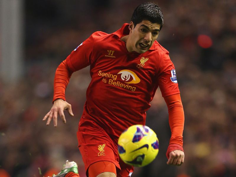 Liverpool striker Luis Suarez charged forward.