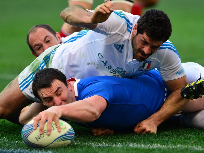 Back in the game: Louis Picamoles scores his fourth try for France despite the attentions of full-back Andrea Masi