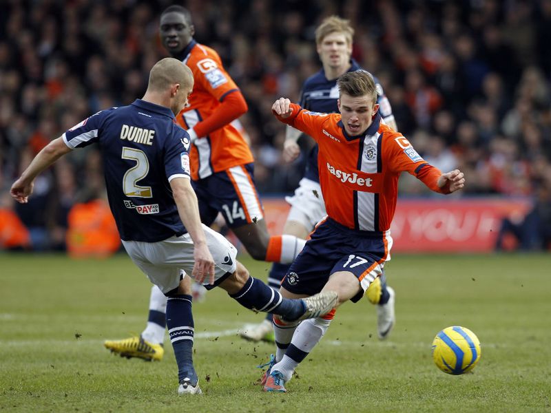 Millwall defender Alan Dunne vies with Luton midfielder JJ ODonnell