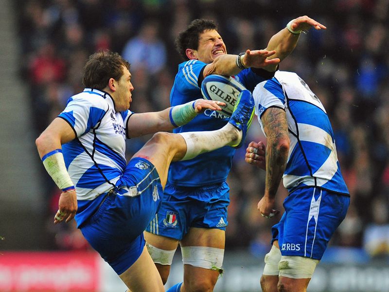 Charged down: Sean Lamont's kick is blocked by Alessandro Zanni