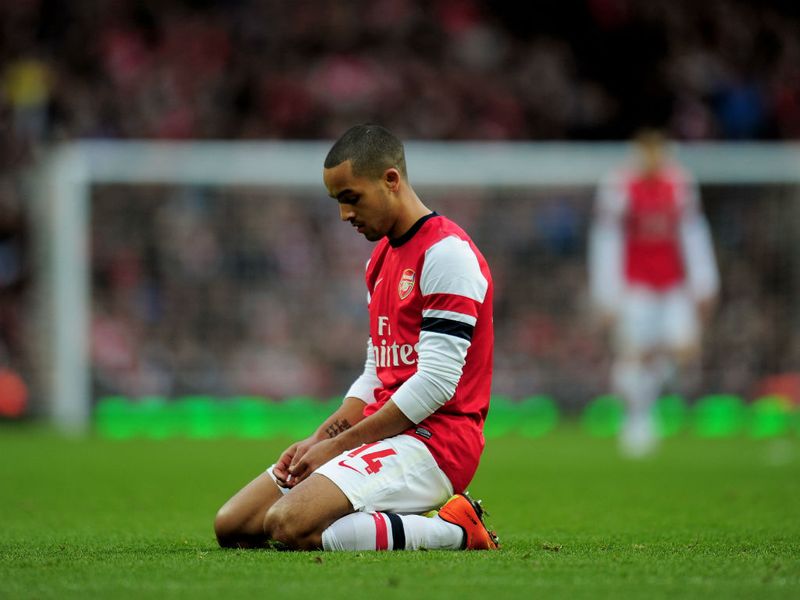 Theo Walcott was left slumped as Arsenal were dumped out of the FA Cup