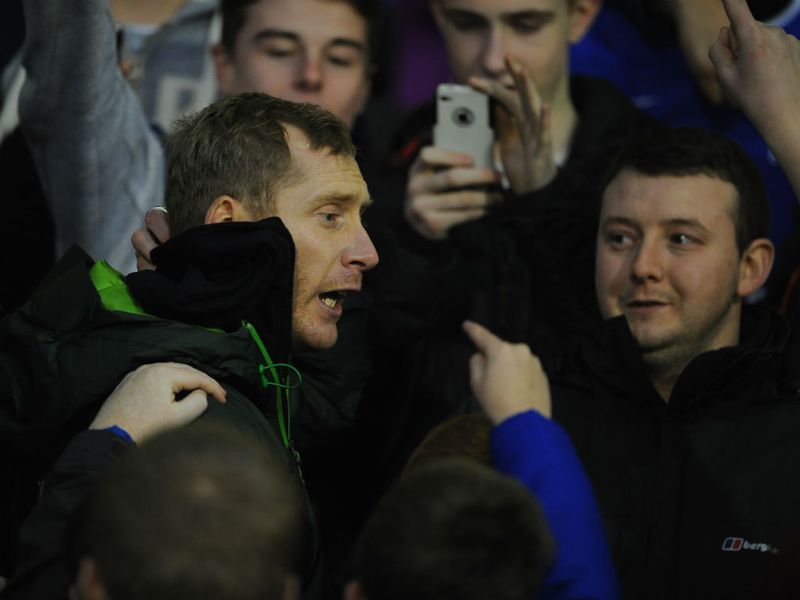 Everton defender Tony Hibbert watches the game from the away end