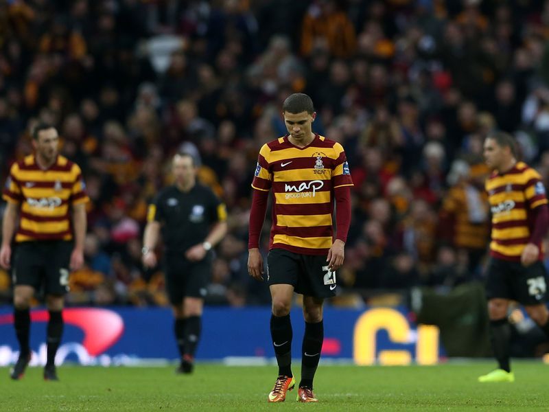 Bradford's players cut dejected figures as they head into the break 2-0 down