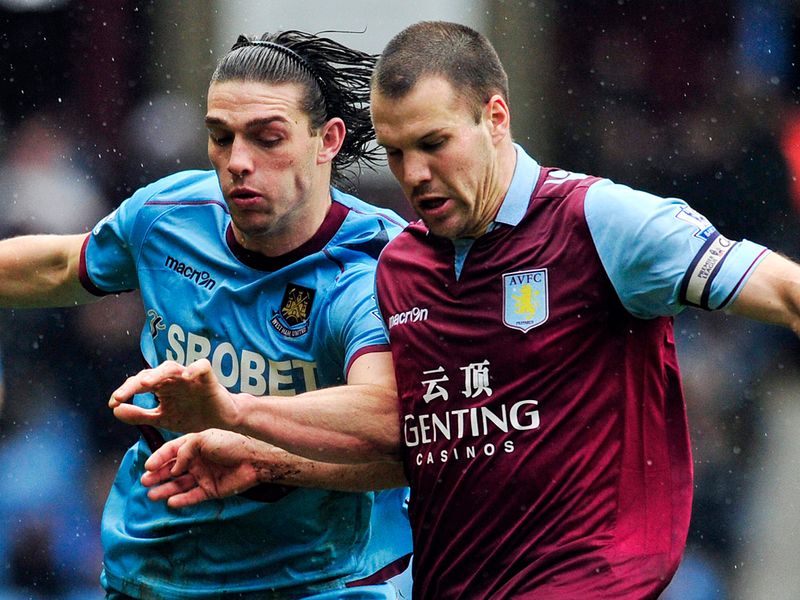 West Ham striker Andy Carroll vies for the ball with Villa's Dutch defender Ron Vlaar in a goalless opening half.