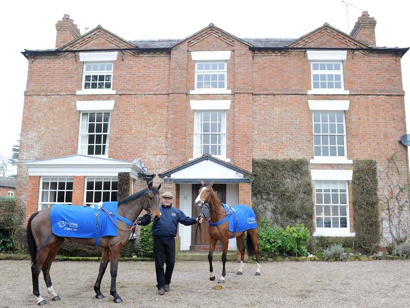 McCain and the big two pose in front of the trainer's house