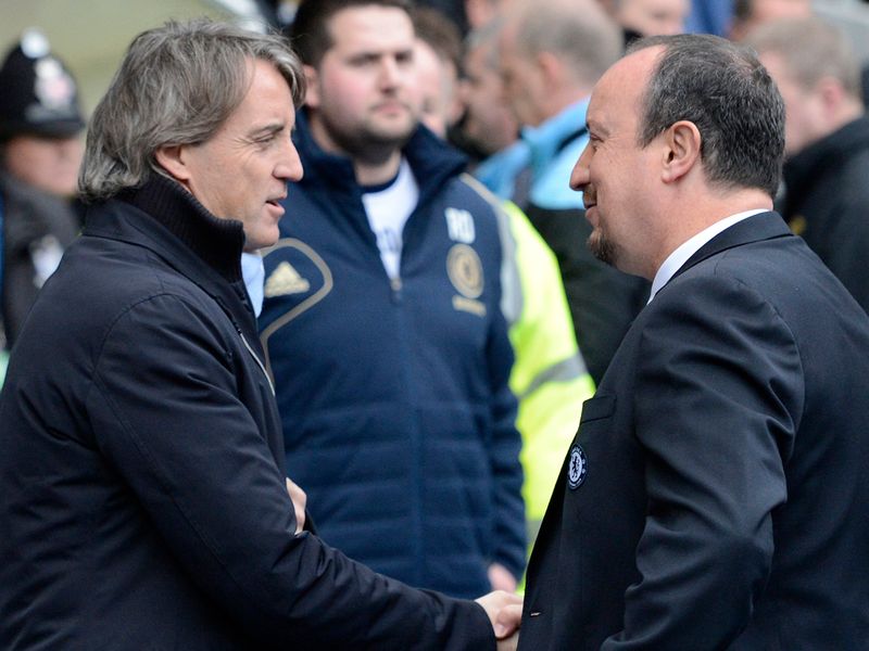 Roberto Mancini welcomes Chelsea counterpart Rafa Benitz to the Etihad ahead of kick-off.