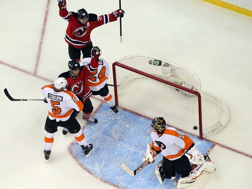 The Devils celebrate a Henrique goal