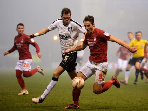 Richard Stearman and Chris Cohen battle for the ball