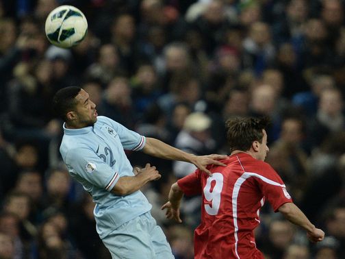 Gael Clichy wins a header.