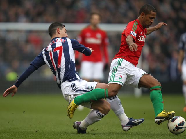 Graham Dorrans challenges Wayne Routledge