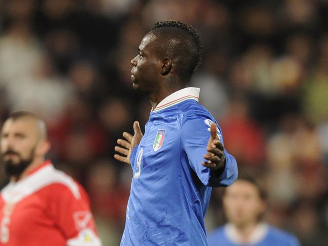 Mario Balotelli celebrates for Italy
