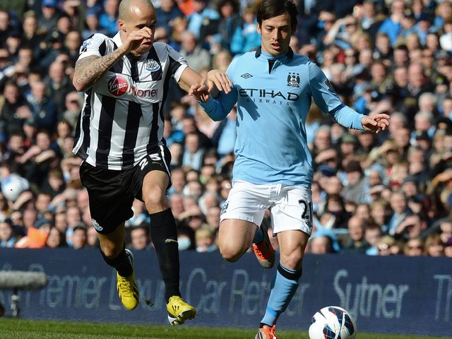 Gabriel Obertan vies for the ball with David Silva