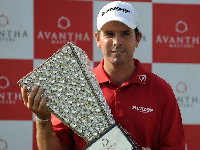 Aiken poses with the Avantha Masters trophy