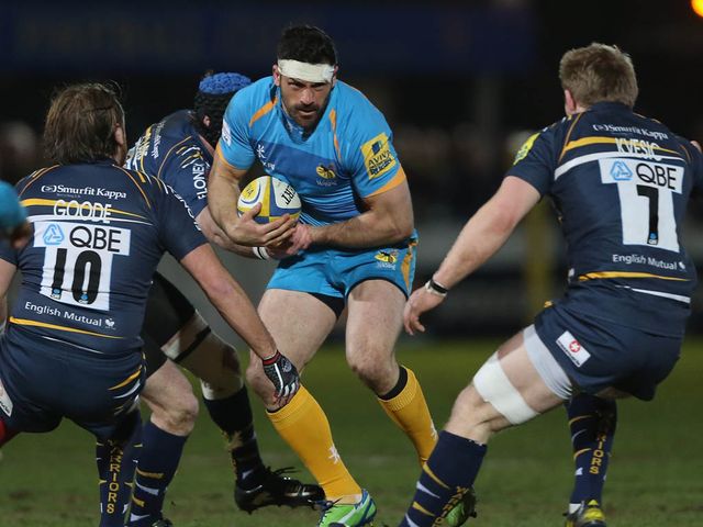 Andrea Masi looks for a way through the Worcester defence