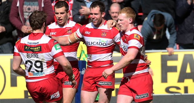 Pat Richards is congratulated by his team mates after scoring his second try of the match