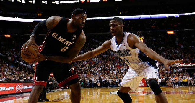 LeBron James is guarded by Moe Harkless