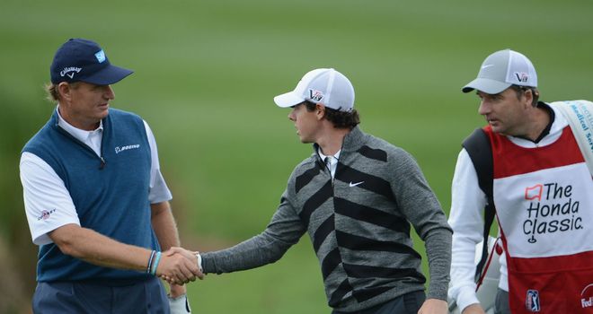 Rory McIlroy shakes hands with Ernie Els before quitting the Honda Classic