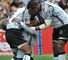 Fijian players celebrate on their way to a record 14th title