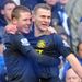 The boyhood Everton fan is congratulated after netting