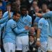 Tevez is congratulated after breaking the deadlock
