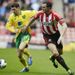 John O'Shea tries to hold off Wes Hoolahan in Sunderland's home match against Norwich