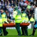 Massadio Haidara is carried from the field on a stretcher after a nasty tackle