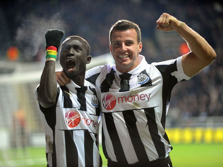 Papiss Cisse celebrates with Steven Taylor