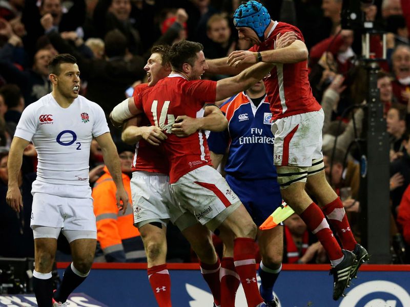 ... and then celebrates with teammates Dan Biggar and Justin Tipuric